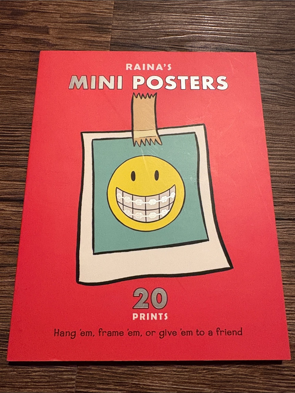Rains Mini Posters - Red Cover with Yellow Smiley